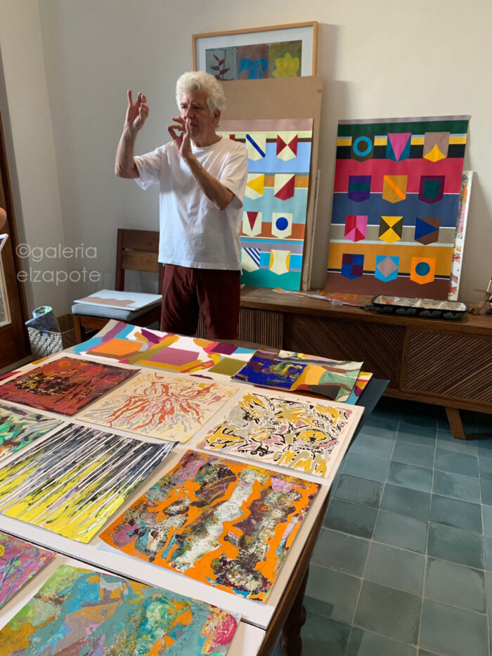 Stephen Aiken in his Mérida studio surrounded by abstract paintings from the “Banderas” series.